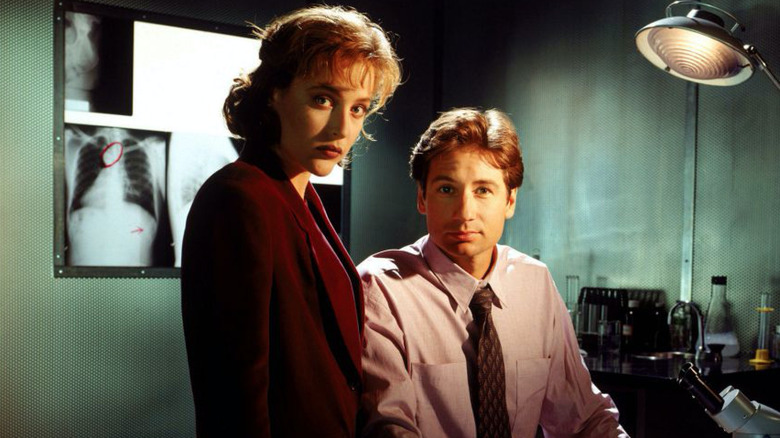 Mulder and Scully pose in a morgue