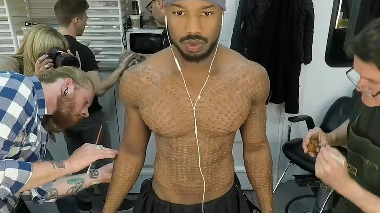 Michael B. Jordan getting makeup applied for Black Panther