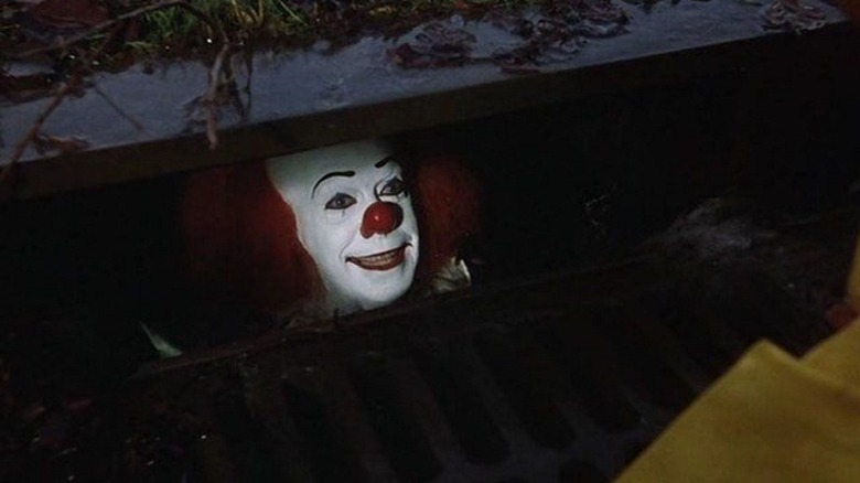 Tim Curry as Pennywise in It