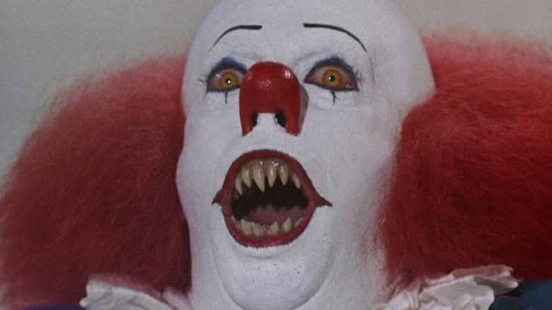 Tim Curry as Pennywise in It