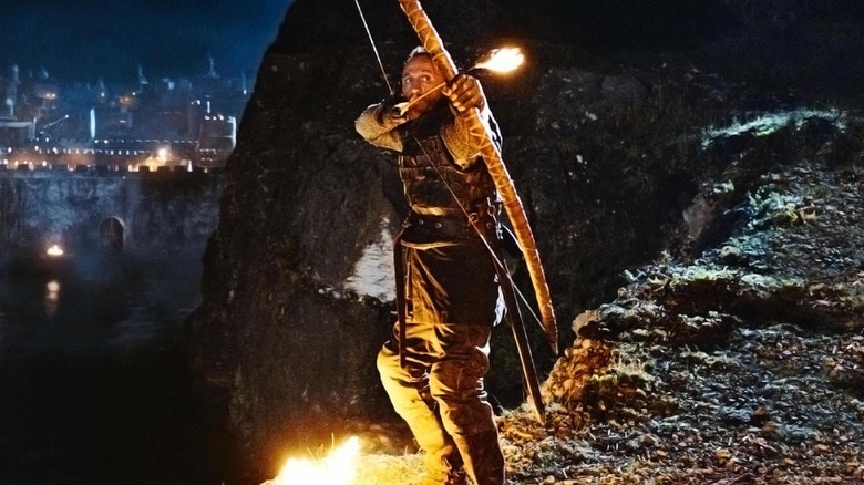 Bronn (Jerome Flynn) aims a flaming arrow on Game of Thrones