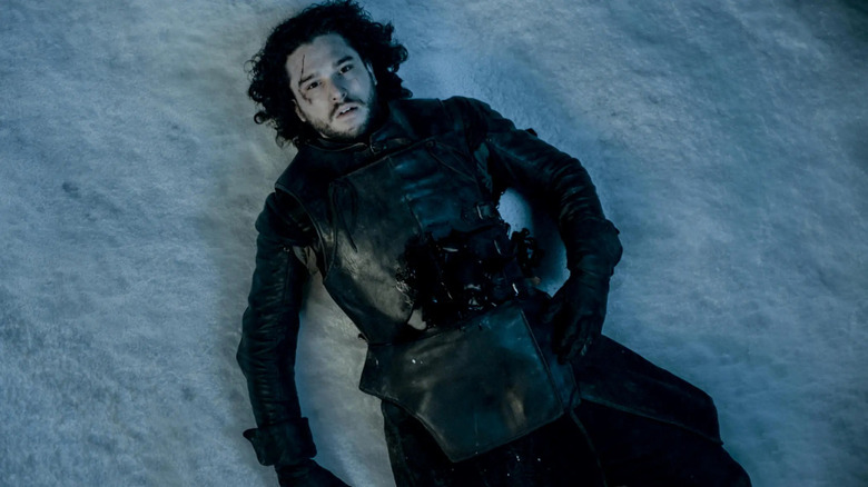 Jon Snow (Kit Harington) lies dead in the snow on Game of Thrones