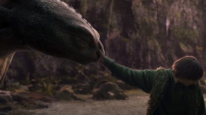 Hiccup puts his hand on Toothless's face in the live-action How to Train Your Dragon movie