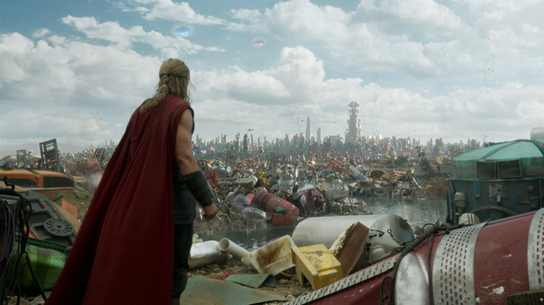 Thor looking over the garbage-strewn Sakaar in Thor: Ragnarok