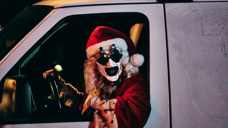 David Howard Thornton as Art the Clown driving a vehicle dressed as Santa in Terrifier 3