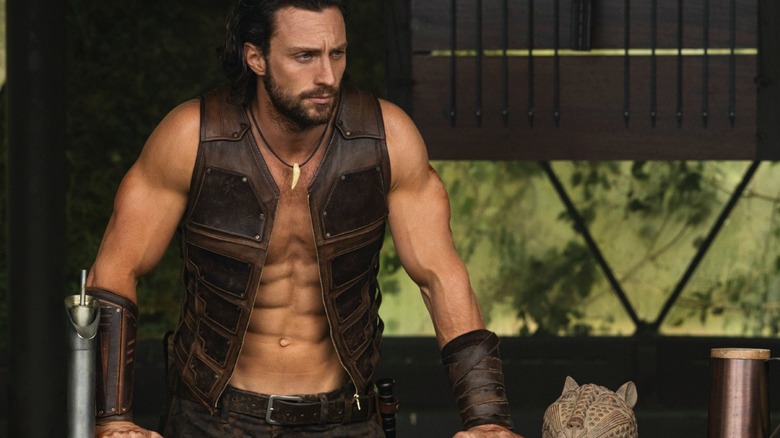 Aaron Taylor-Johnson as Kraven wearing a vest in Kraven the Hunter