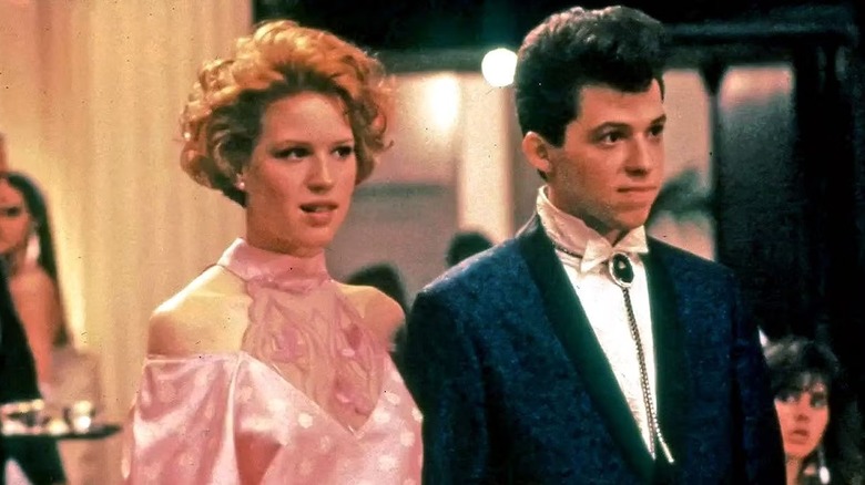 Andie (Molly Ringwald) and Duckie (Jon Cryer) attend prom together in Pretty in Pink