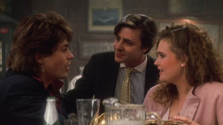 Billy (Rob Lowe) has drinks with Alec (Judd Nelson) and his friend in St. Elmo's Fire