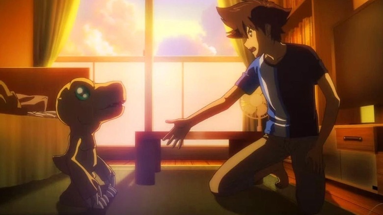 Taichi extending his hand to Agumon in Digimon Adventure: Last Evolution Kizuna