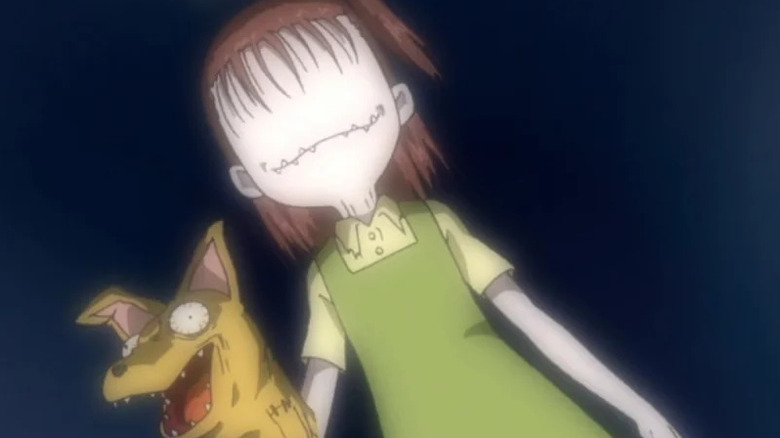 Jari holds a creepy puppet in her hands while her face has no eyes in Digimon Tamers