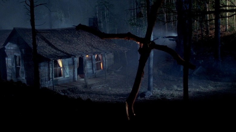 A makeshift grave outside a spooky cabin in the woods. From Evil Dead 2: Dead By Dawn