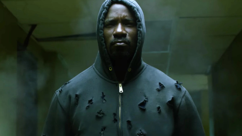 Luke, wearing a hoodie full of bullet holes in Luke Cage