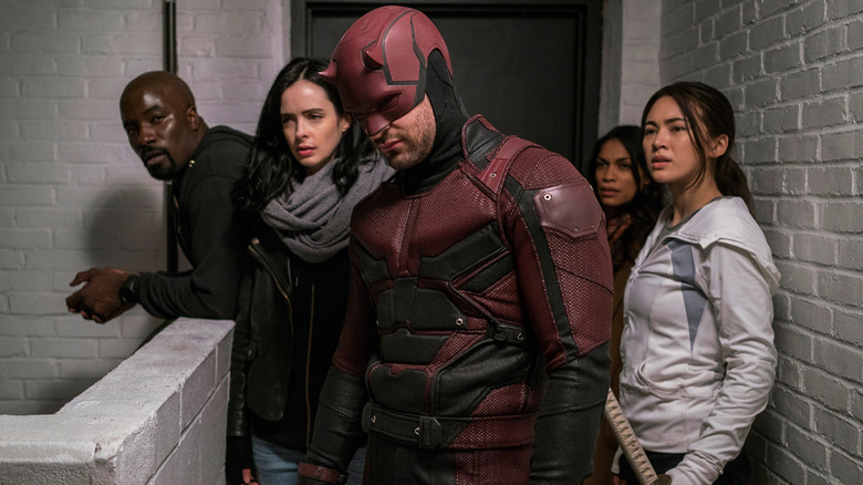 Luke, Jessica, Daredevil, Claire, and Colleen standing in front of a door on The Defenders