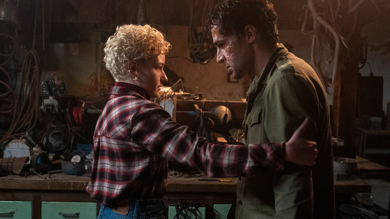 Julia Garner's Charlotte Lovell holding Christopher Abbott's Blake Lovell in Wolf Man