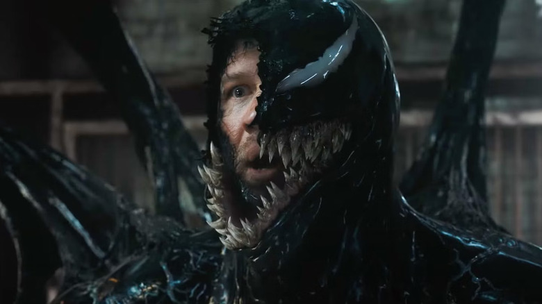 Eddie Brock, wrapped in Venom glop, looking surprised in Venom: The Last Dance