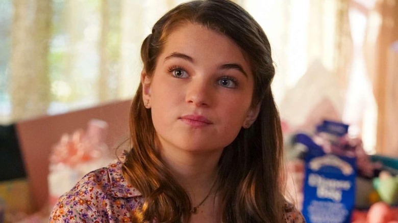 Missy Cooper sitting in her bedroom and smiling on Young Sheldon