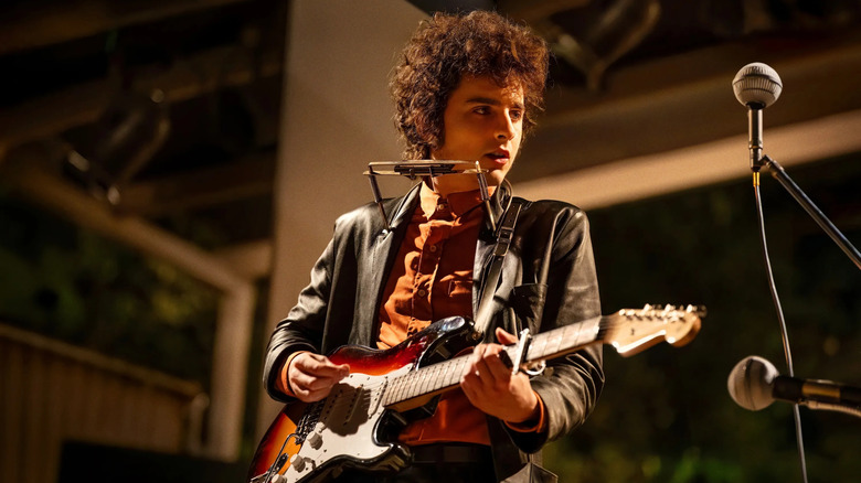 Bob Dylan playing electric guitar in A Complete Unknown