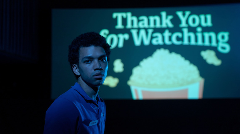 Owen standing in an empty movie theater in I Saw the TV Glow