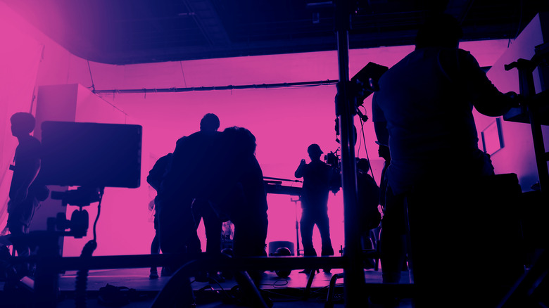 Behind the scenes on a set with pink lighting