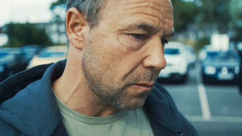 Stephen Graham's Eddie Miller looks worried in closeup in Adolescence