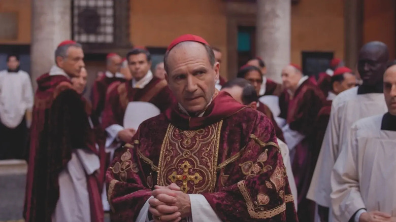 Cardinal Lawrence in Conclave surrounded by other Cardinals