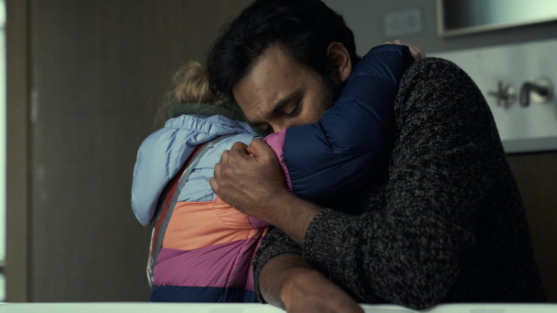 Himesh Patel as Jeevan hugs Matilda Lawler as young Kirsten in Station Eleven