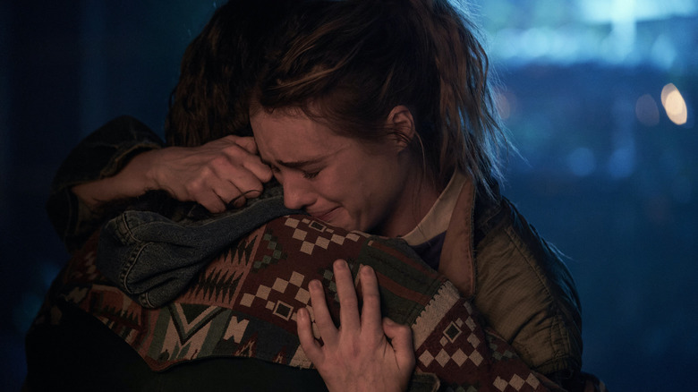 Himesh Patel as Jeevan hugs Mackenzie Davis as Kirsten in Station Eleven