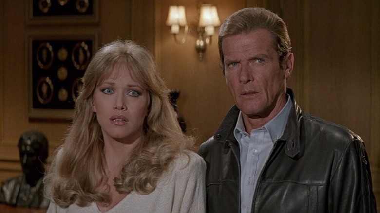 Roger Moore and Tanya Roberts stand together in A View to Kill