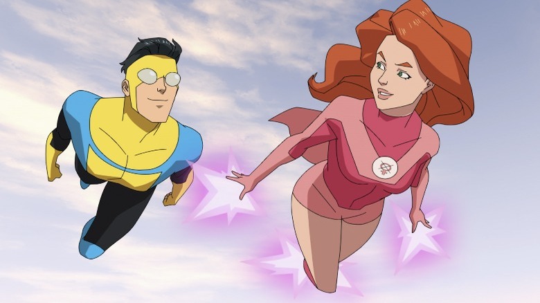 Invincible and Atom Eve flying