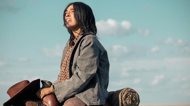 Teonna Rainwater looking distraught on the back of a horse in 1923