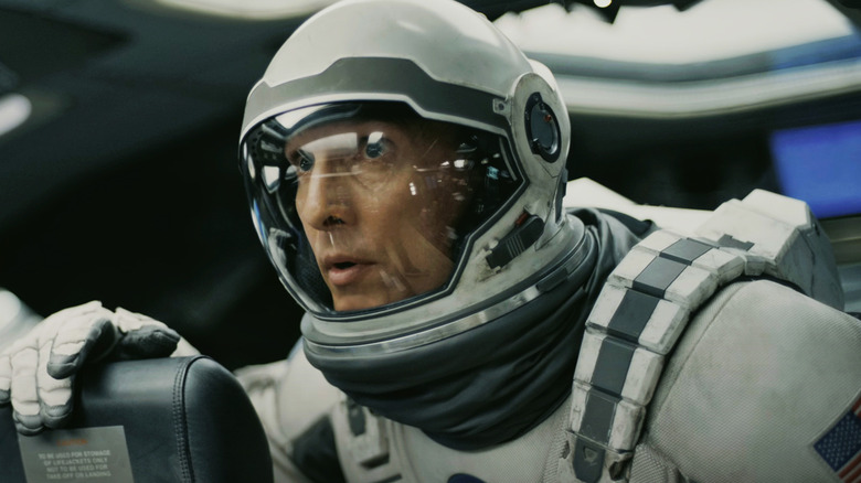 Joseph Cooper by Matthew McConaughey looks worried in his space combination in Interstellar