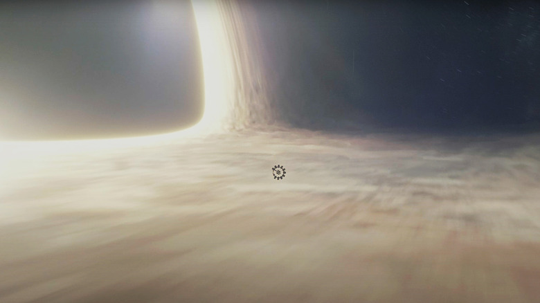 A ship is caught in the event horizon of the Gargantua black hole in Interstellar