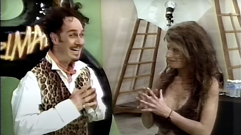 John Kassir as Jean Michael and Katherine Kousi as Lucy the Cavewoman in Encino Woman