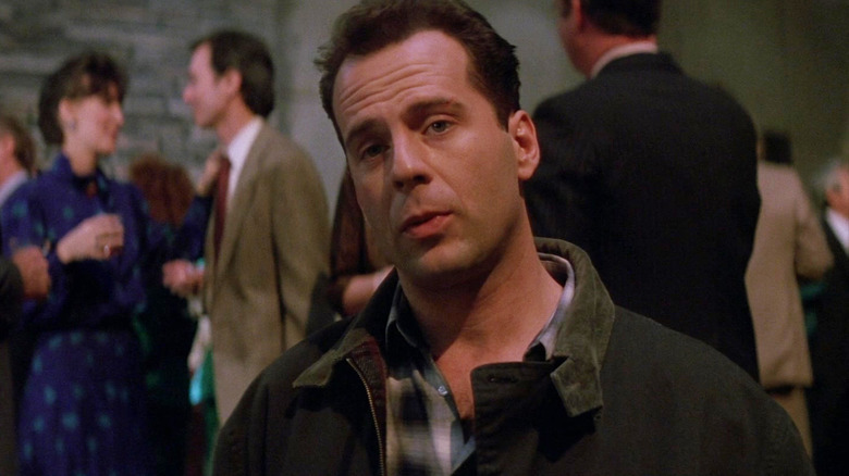 Bruce Willis as Johnon McClein at the office party at Die Hard