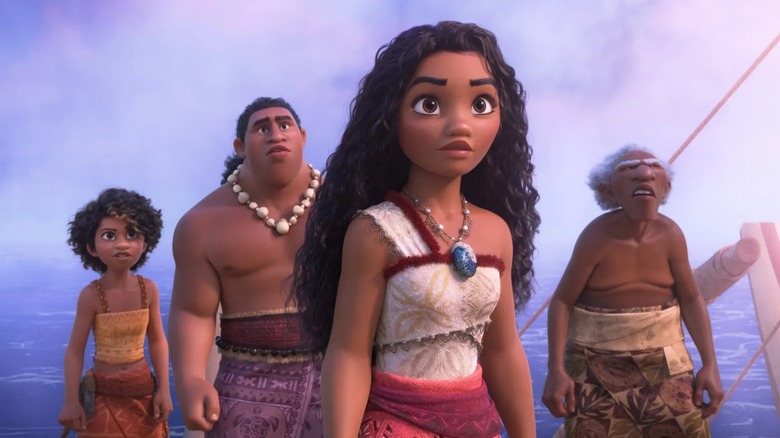 Moana and others from the island of Motonui standing on a boat in the middle of the ocean in Moana 2