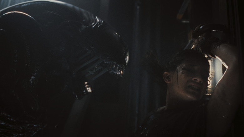 Cailee Spaeny as Rain Carradine flinging away from a deadly Xenomorph in Alien: Romulus