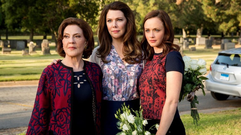 Kelly Bishop as Emily, Lauren Graham as Lorelei, and Alexis Bledel as Rory at a cemetary in Gilmore Girls: A Year in the Life