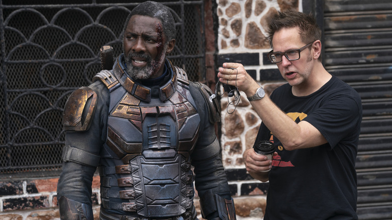 James Gunn on the set of "The Suicide Squad" directing Idris Elba as Bloodsport in a behind-the-scenes still