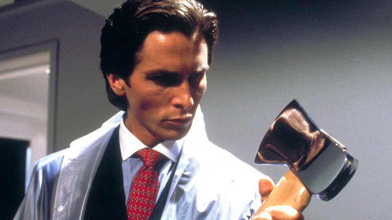 Patrick Bateman in American Psycho holding an ax