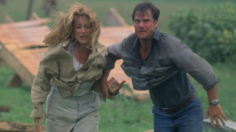 Jo (Helen Hunt) and Bill (Bill Paxton) running from a tornado in Twister