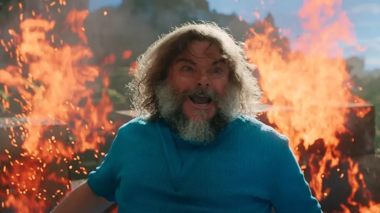 Jack Black runs from flames as Steve in Minecraft