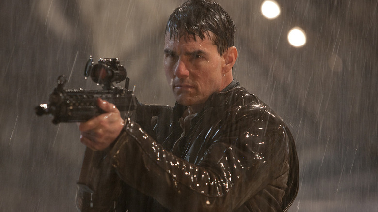 Tom Cruise is wet and packing heat as Jack Reacher in Jack Reacher