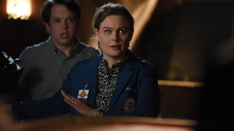 Emily Deschanel's Temperance Brennan gestures to her right in Bones