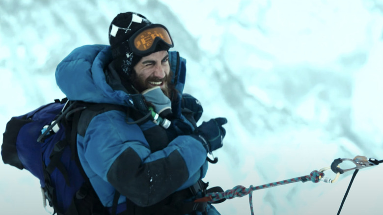 Jake Gyllenhaal's Scott Fischer uses a rope to climb a snowy incline in Everest