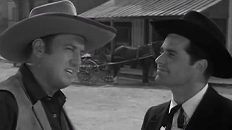 James Garner as Bret Maverick humors a humorless Ben Gage as Mort Dooley in Maverick