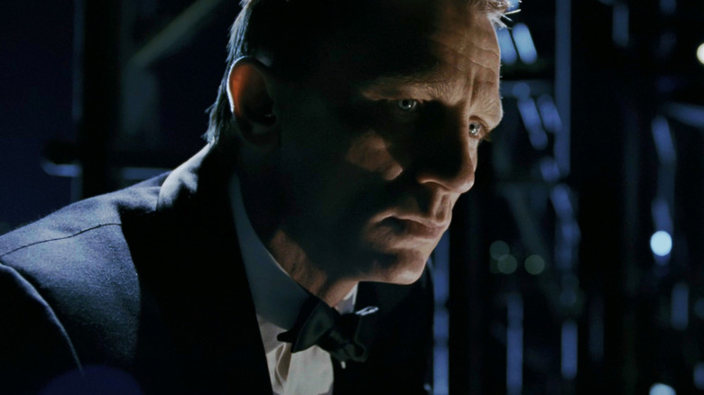 Daniel Craig as Jameseyms Bond looks desperate in shadows