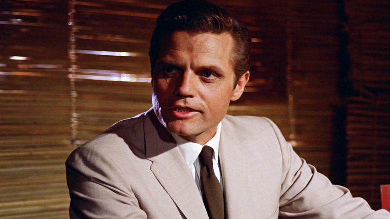 Jack Lord's Felix Leiter is seen looking across frame in Dr No