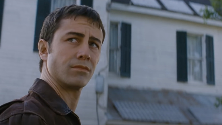 Young Joe outside a farmhouse in Looper