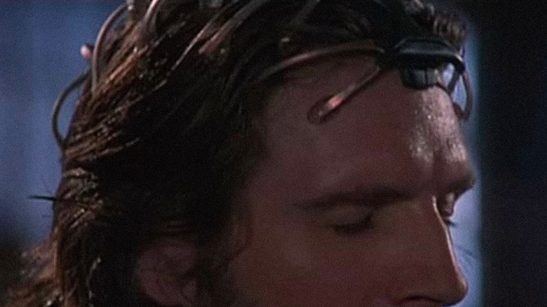 Lenny (Ralph Fiennes) plays back a memory clip in Strange Days