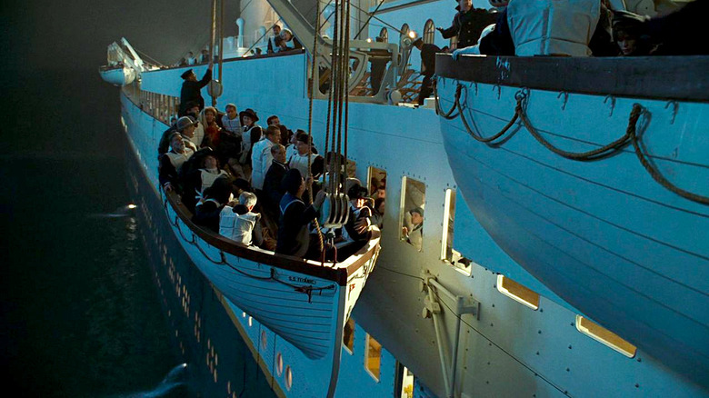 Passengers board onto lifeboats in Titanic